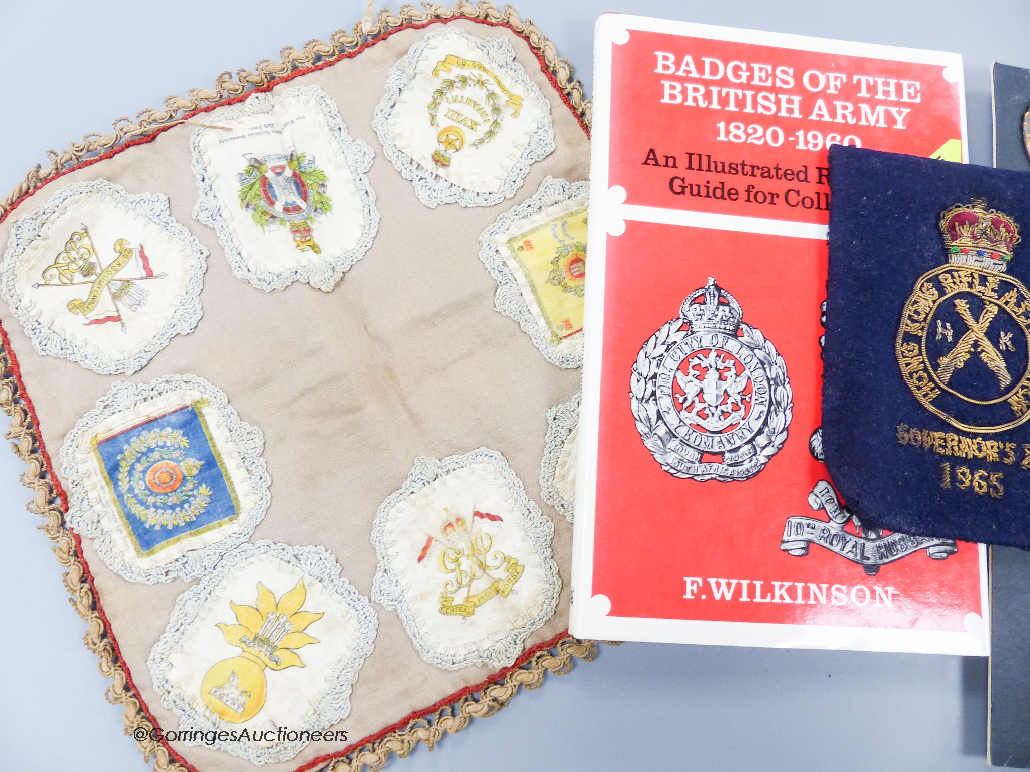 A collection of Military cap badges